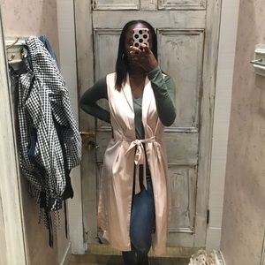 Long pink sleeveless duster jacket